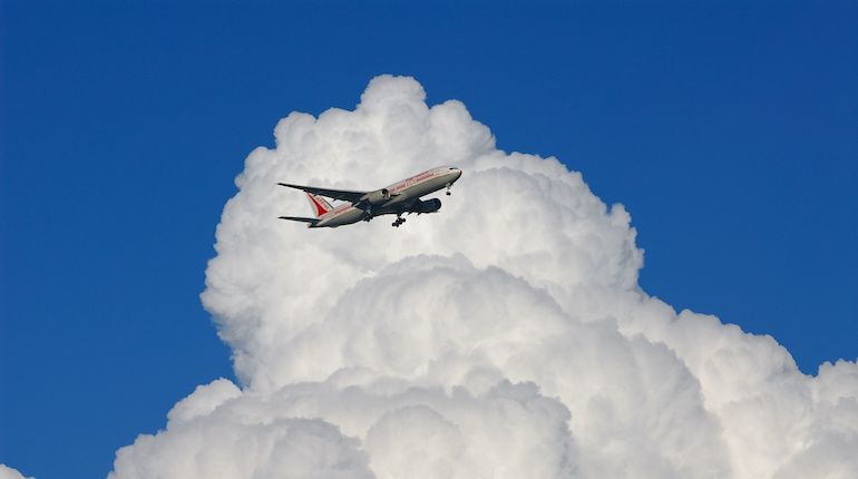 Lone Air India jet airplane amongst cumulonimbus clouds